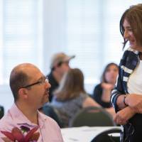 Dean Hiskes chats with faculty and staff members.